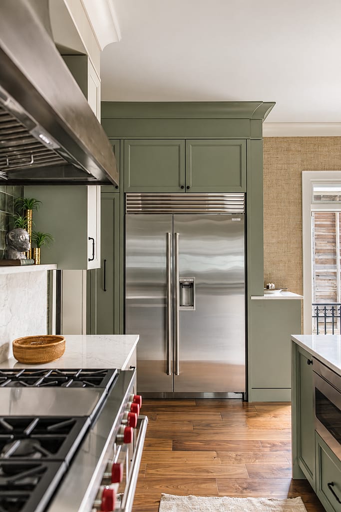 stainless refrigerator in cabinet