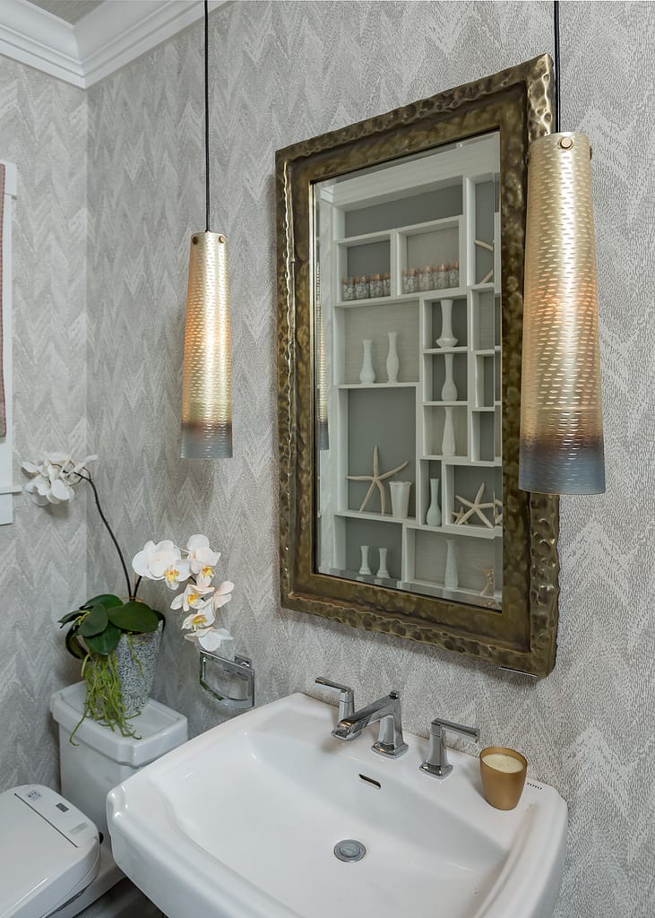 The style of fixtures in a powder bath is oh so important to the overall design plan.