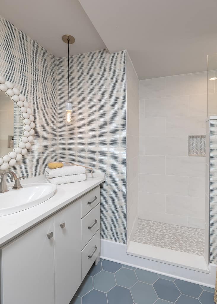 White and Blue Scandinavian Master Bathroom remodel with blue wallpaper