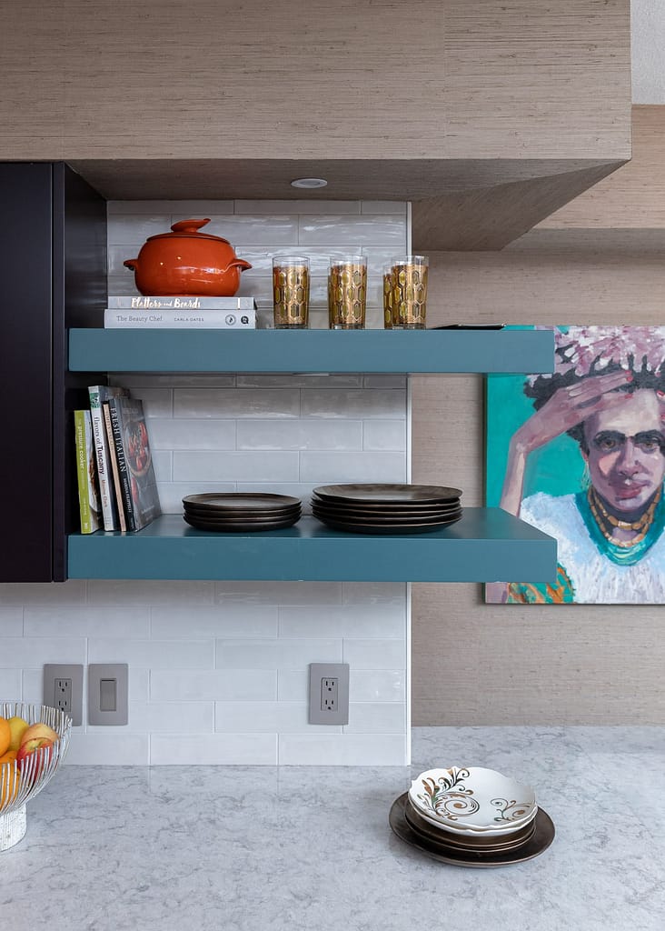 blue floating shelves, white tile backsplash, purple cabinets, nancy rhodes harper art , frida kahlo art, coastal condo remodel, kitchen remodel, pensacola beach florida