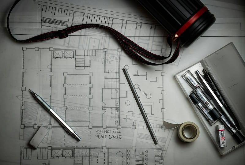 Architectural plan set and drafting tools prepared for a Bainbridge Island building permit application